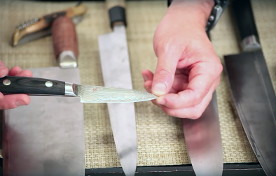 close up of hands holding a Ittosai petty knife