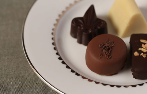 close up of four Jordan Winery chocolate truffles presented on small plate