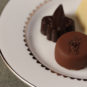 close up of four Jordan Winery chocolate truffles presented on small plate