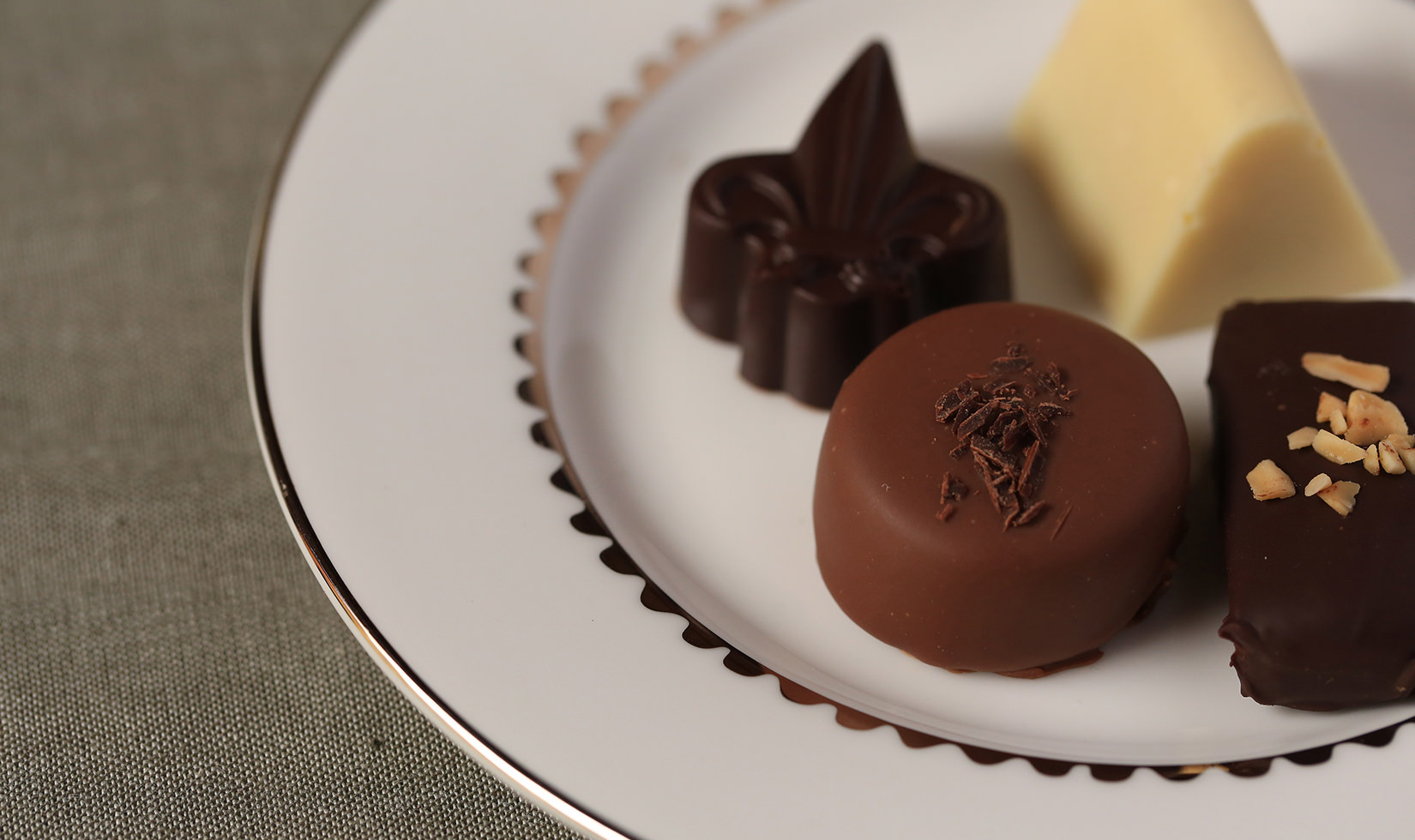 Chocolate truffles presented on small white plate