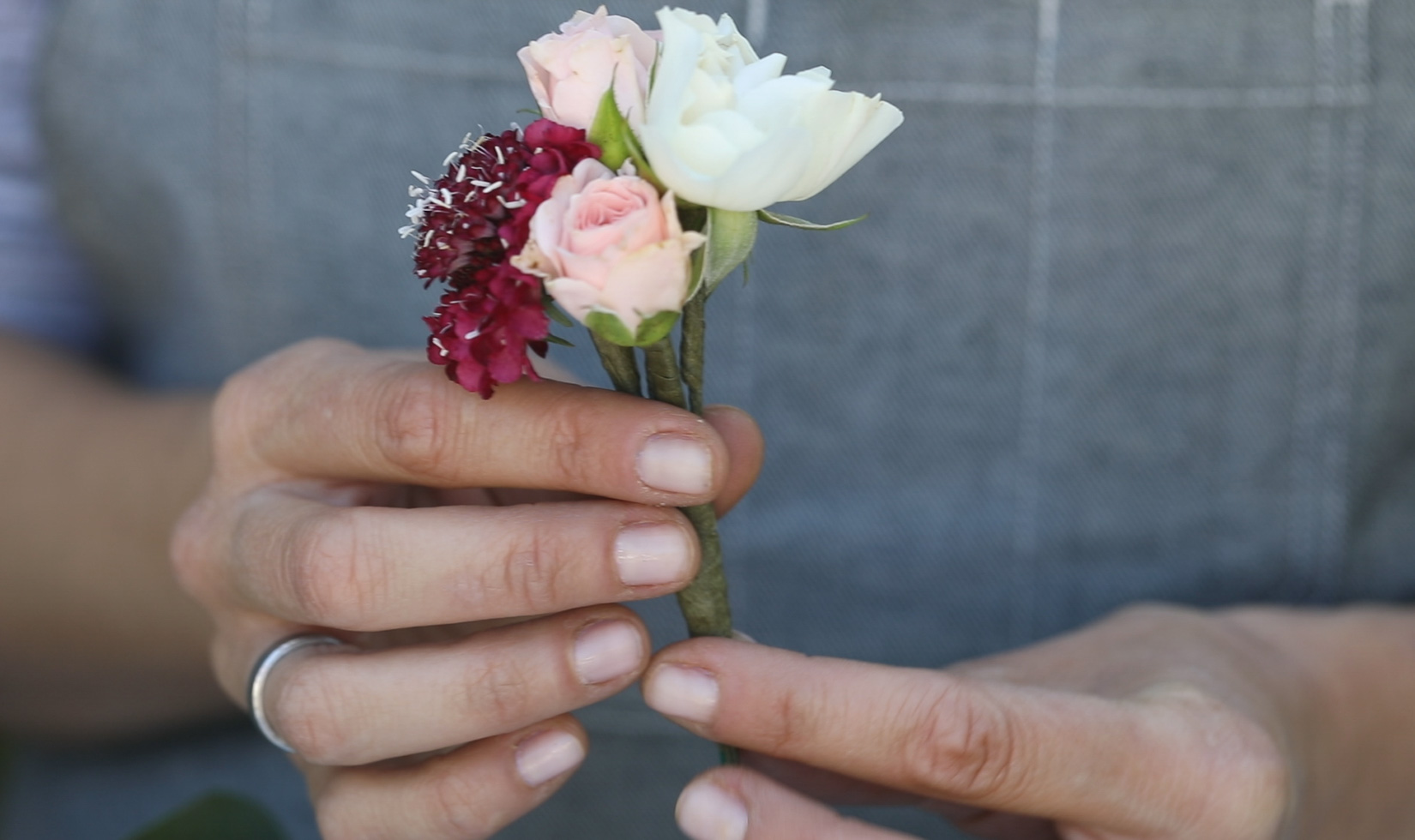 Mini flower bouquet in hands