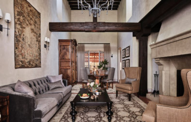 Jordan suite living room with elegant furniture and wooden beam across ceiling