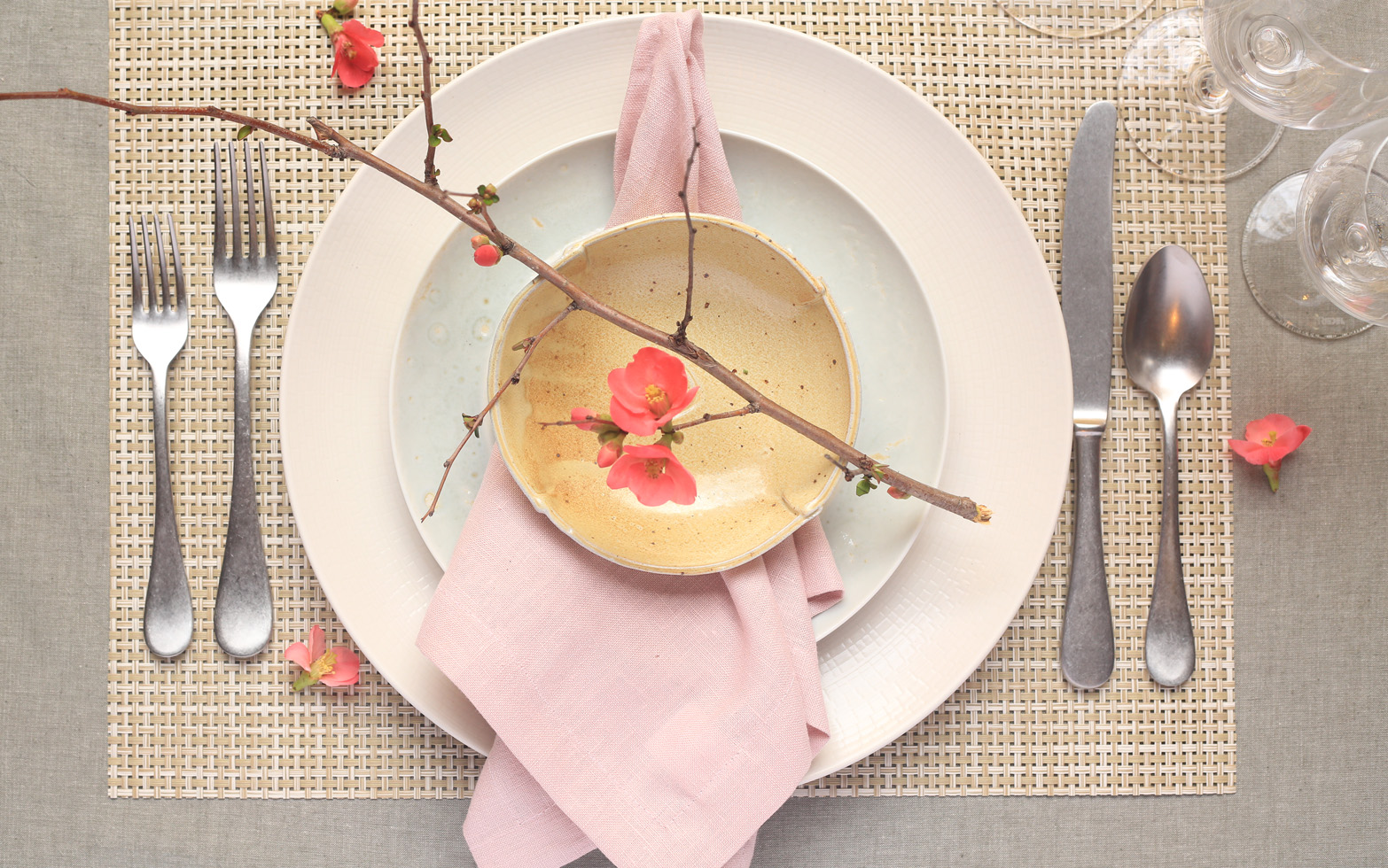 spring dinner table place setting with cherry blossoms