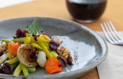 yellow wax bean salad with grilled onions and a glass of cabernet wine