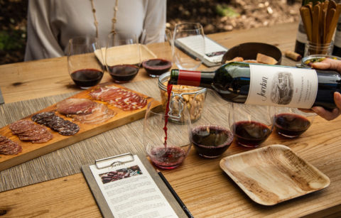 Jordan Winery chateau block table setting with charcuterie and hand pouring Jordan Cabernet for red wine flight