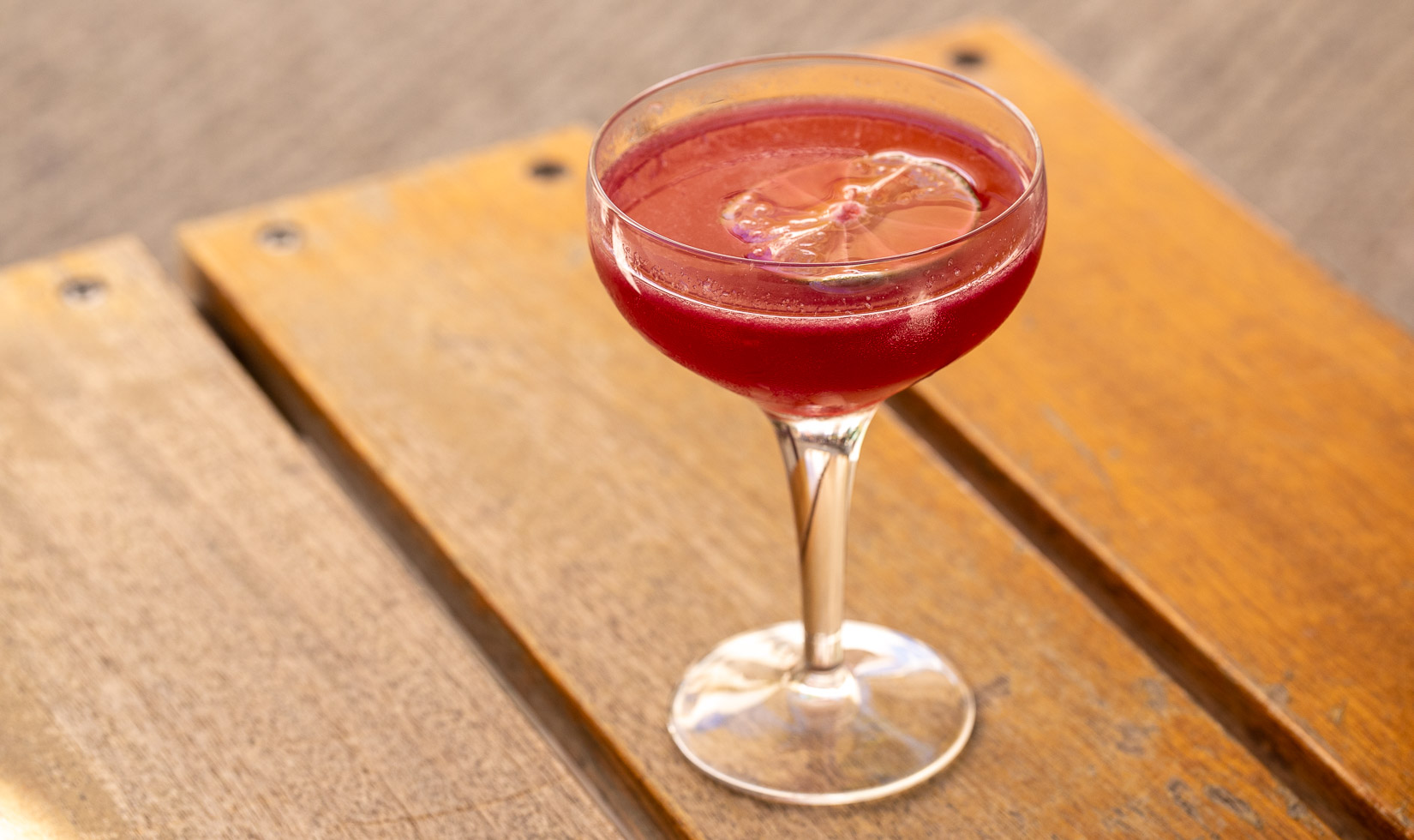 "Lady in Red" Cocktail with dehydrated lime garnish at Campo Fina Healdsburg