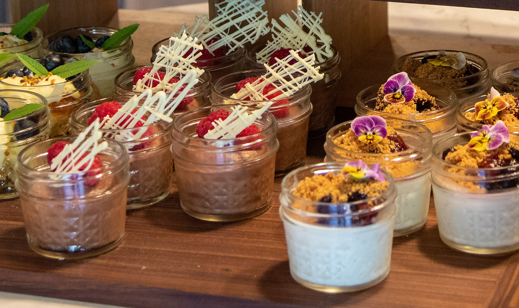 Chocolate mousse and panna cotta in mason jars for a picnic dessert