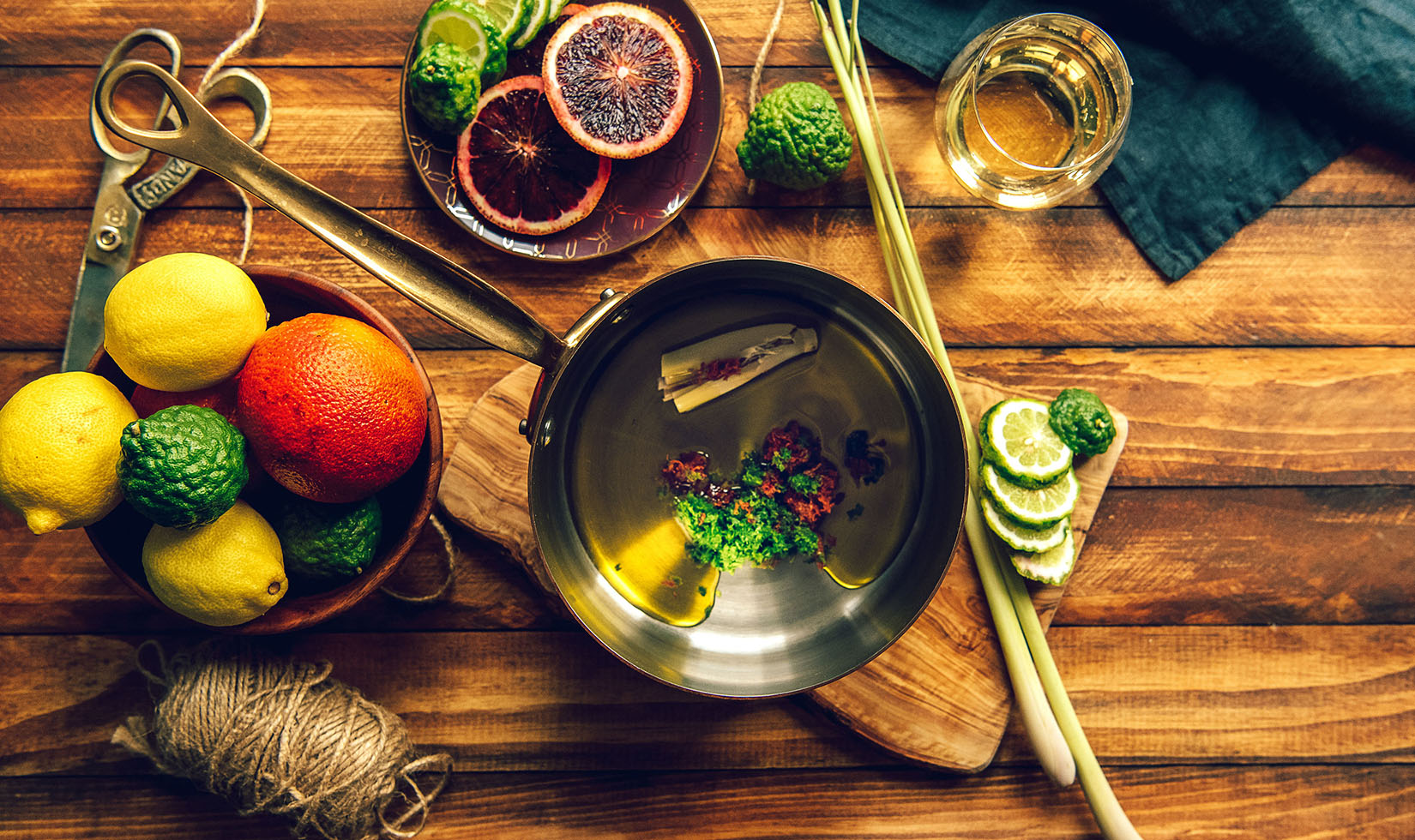 A selection of citrus in a saucepan for Citrus Infused Olive Oil.