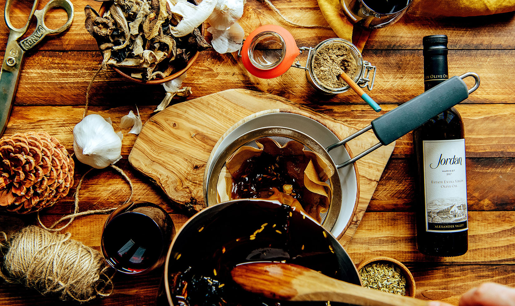 Straining boiled mushroom mixture before infusing with olive oil for a Mushroom Infused Olive Oil