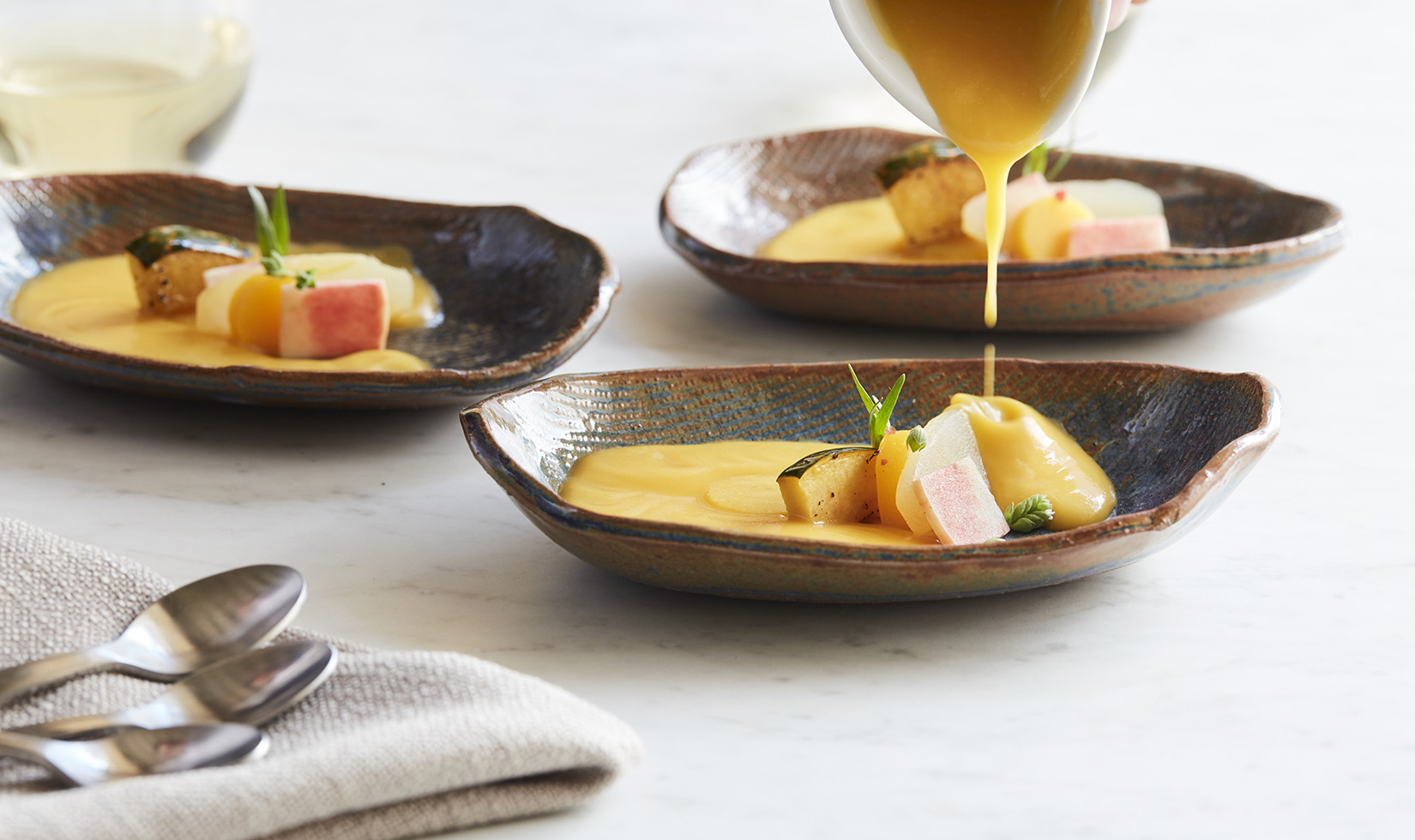 Kabocha Squash and Golden Millet Soup poured into bowl