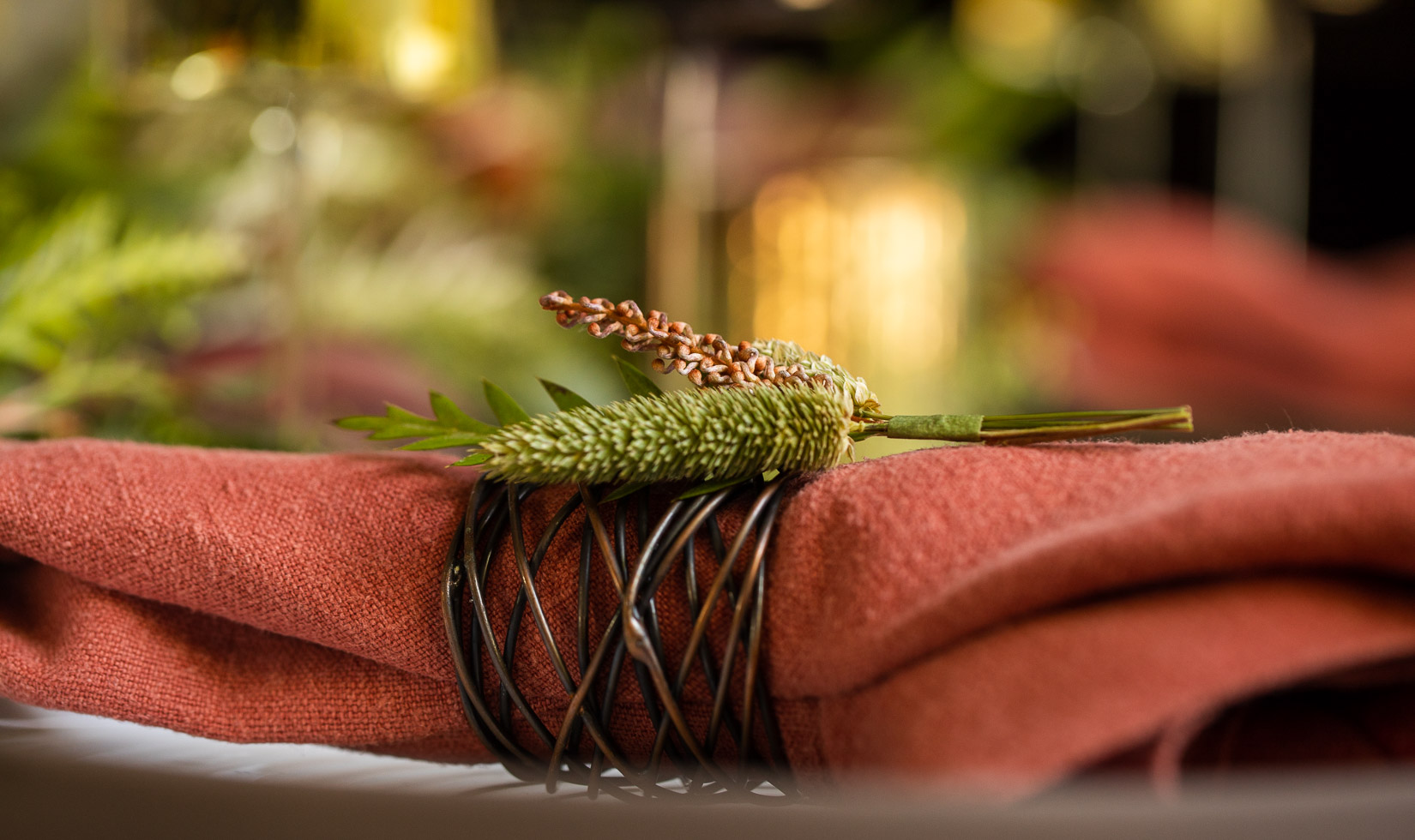 coral napkin with copper napkin ring