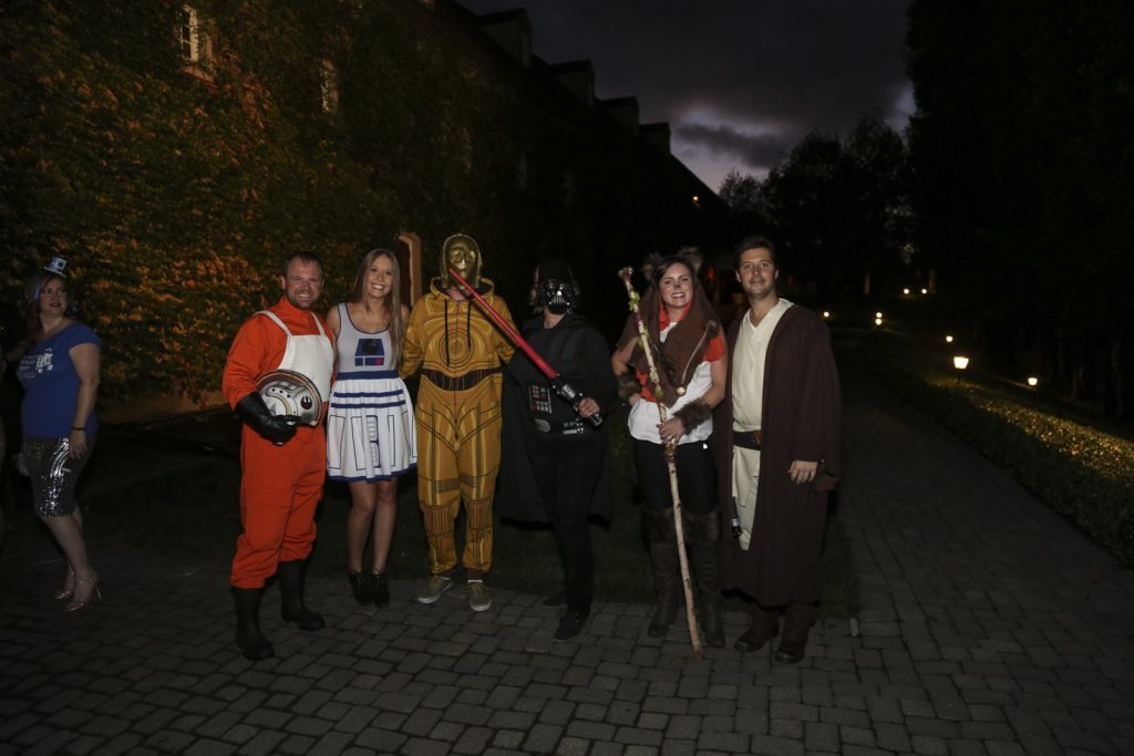 Guests dressed up for a Jordan Winery Star Wars Halloween party posing outside.