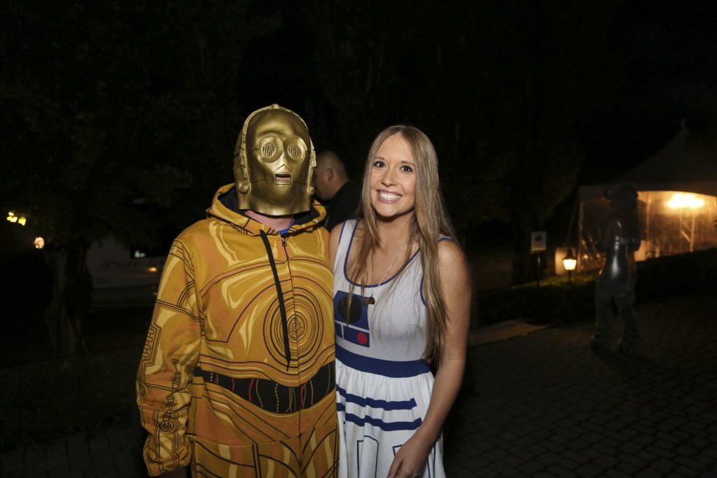 Guests dressed up for Star Wars Halloween party posing outside.