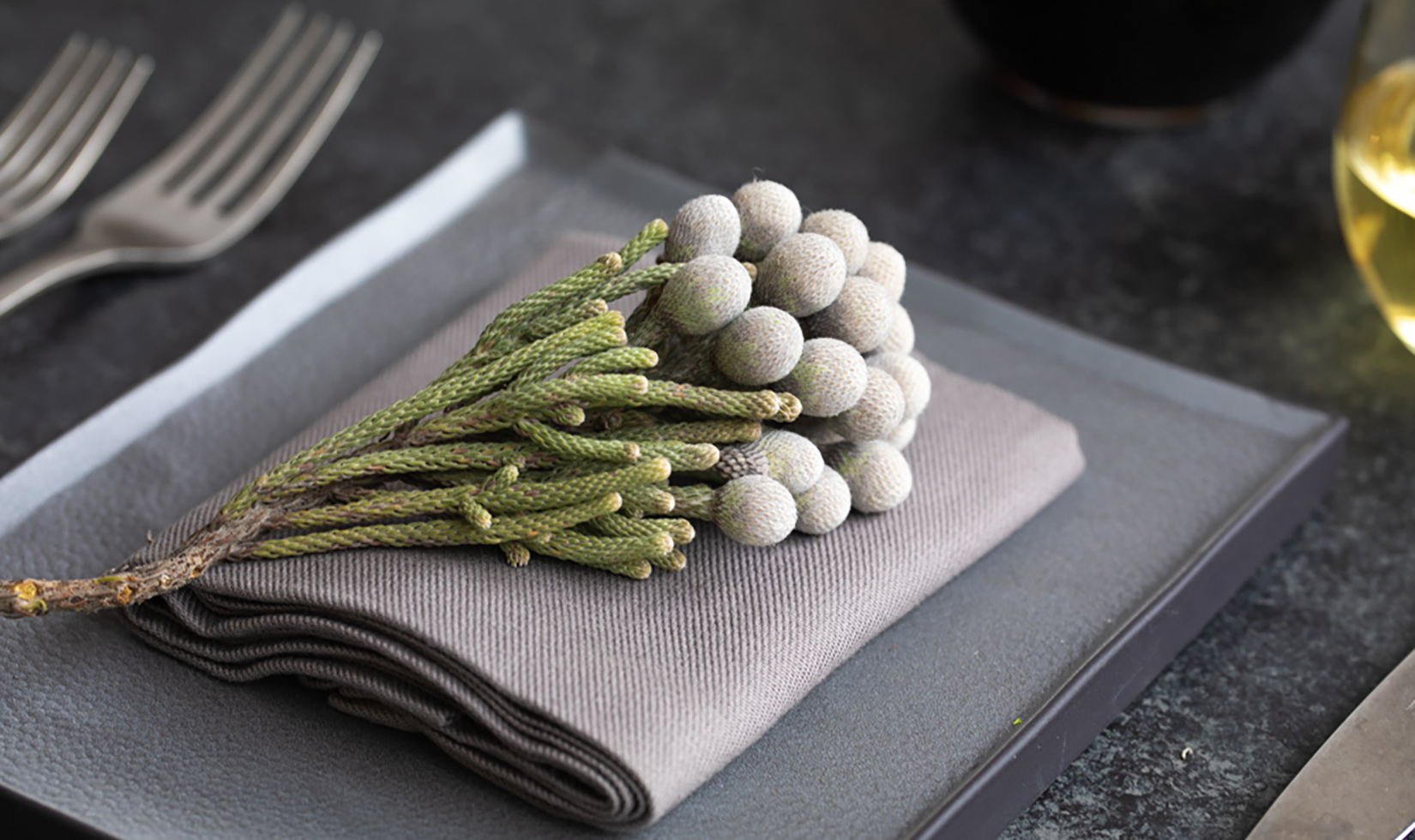 Silver Brunia Berries place setting on gray plate