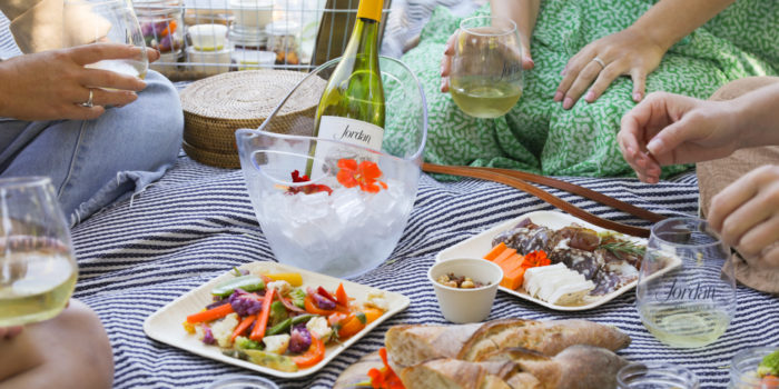 outdoor jordan winery picnic with jordan chardonnay and snacks