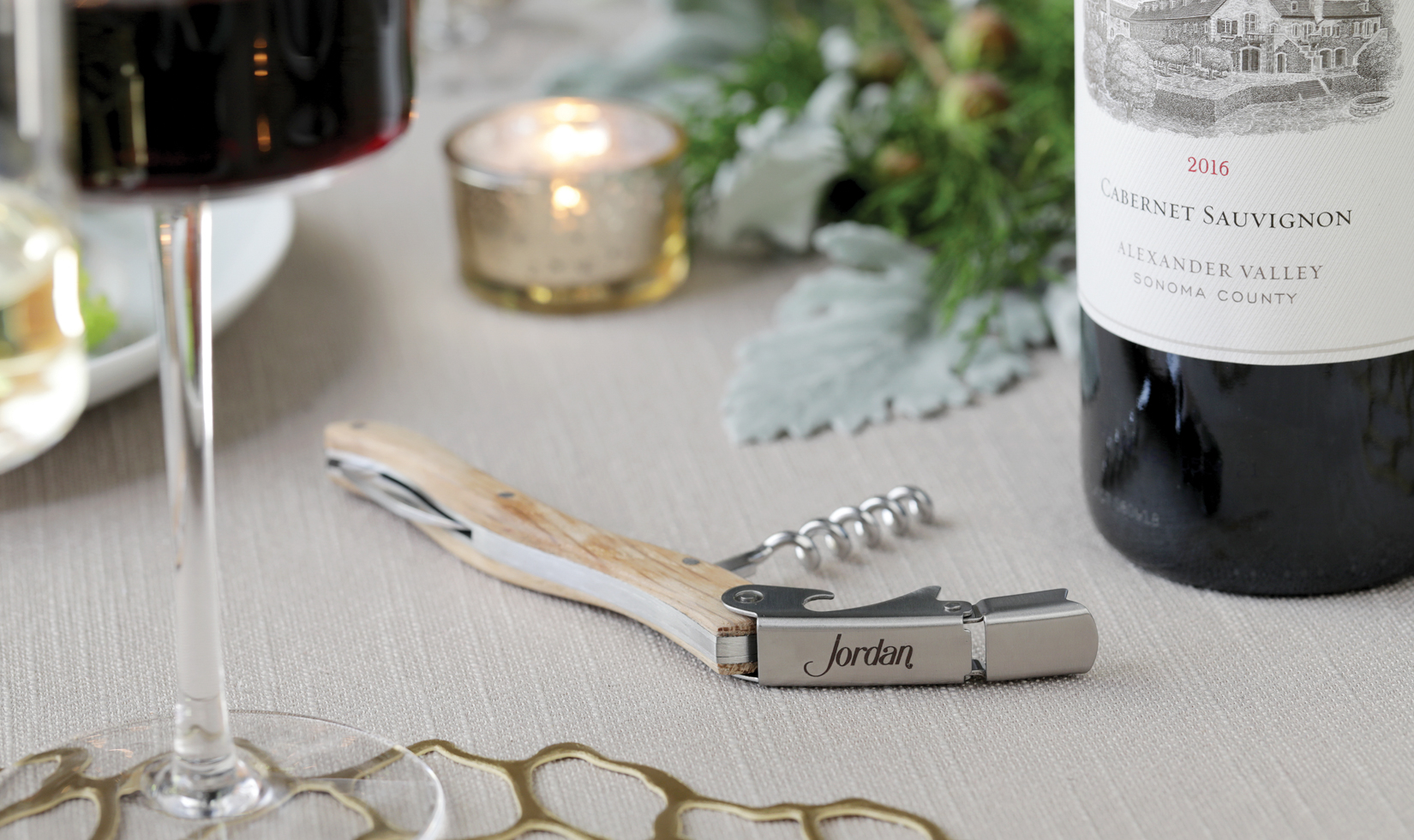 jordan winery wine barrel corkscrew on holiday table with cabernet 