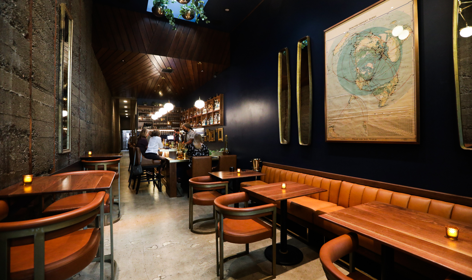 wide angle of interior of bar with leather seats