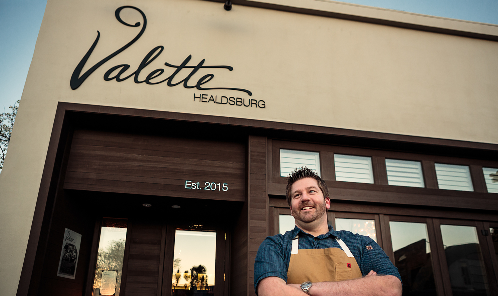 Restaurant Owner standing outside restaurant