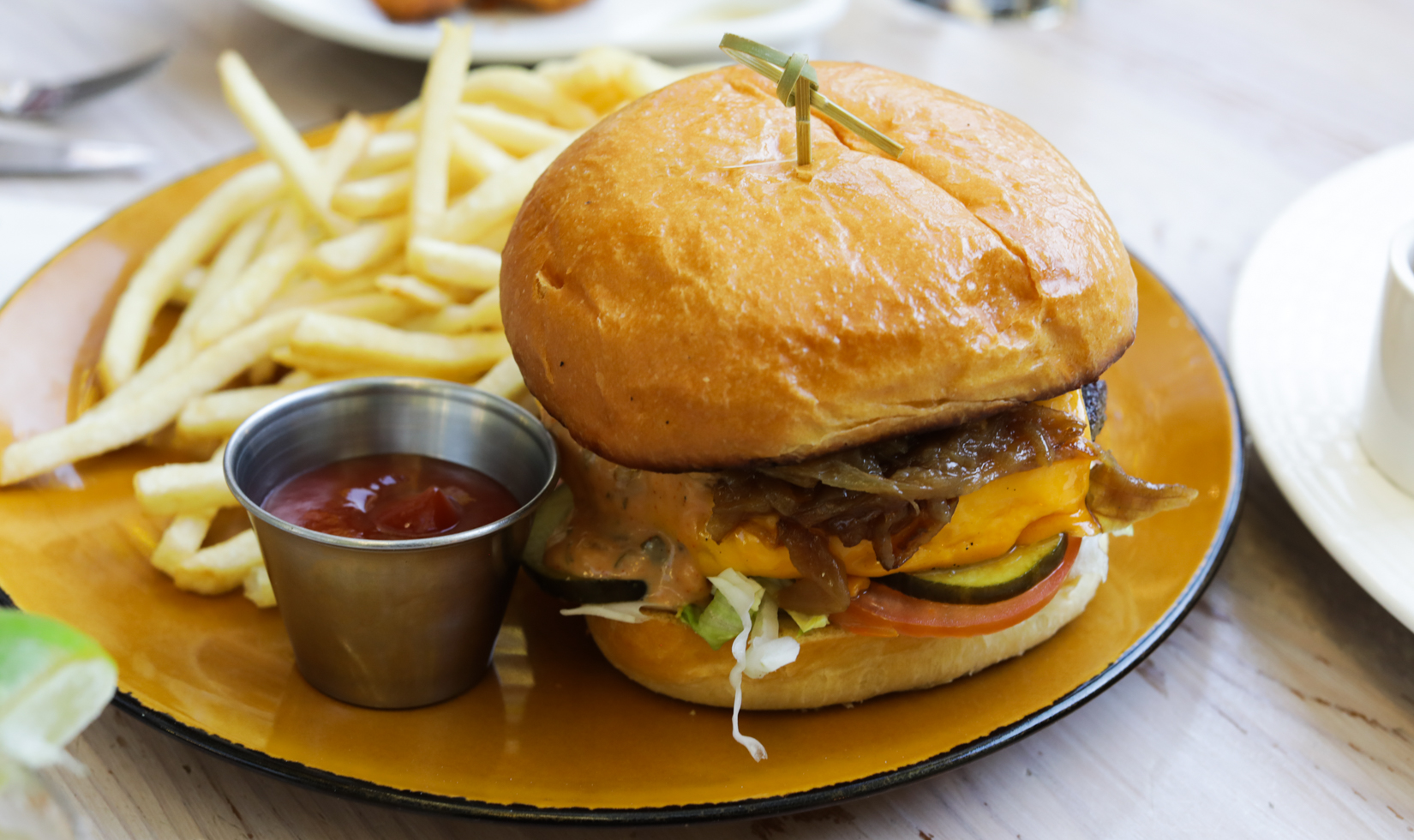 smash burger with side of french fries and ketchup