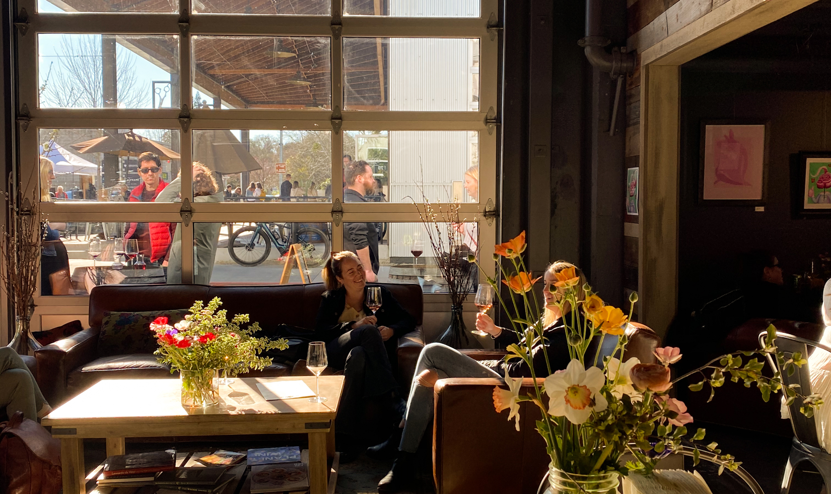 interior of tasting room with flowers and wine on tables