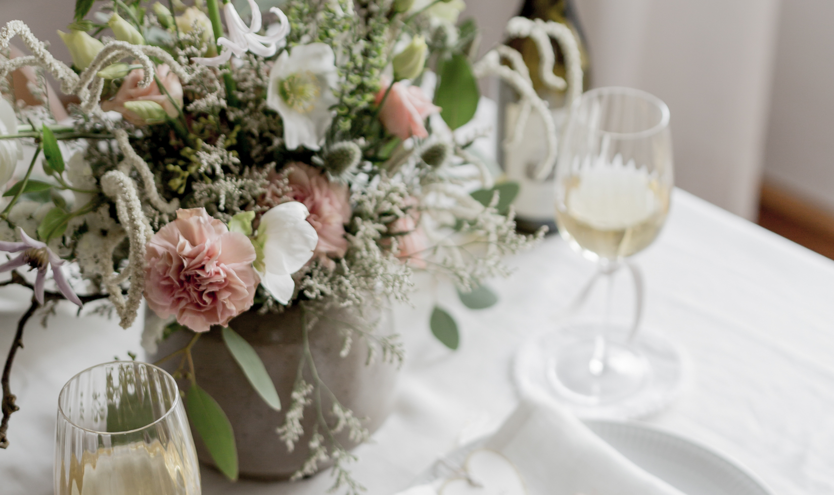 Intimate and Elegant Birthday Party Ideas beautiful flowers in centerpiece table with wine glasses