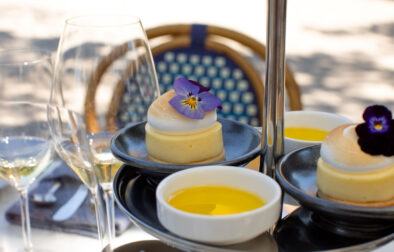 tiered tray of culinary bites for wine featured lemon tarts and olive oil