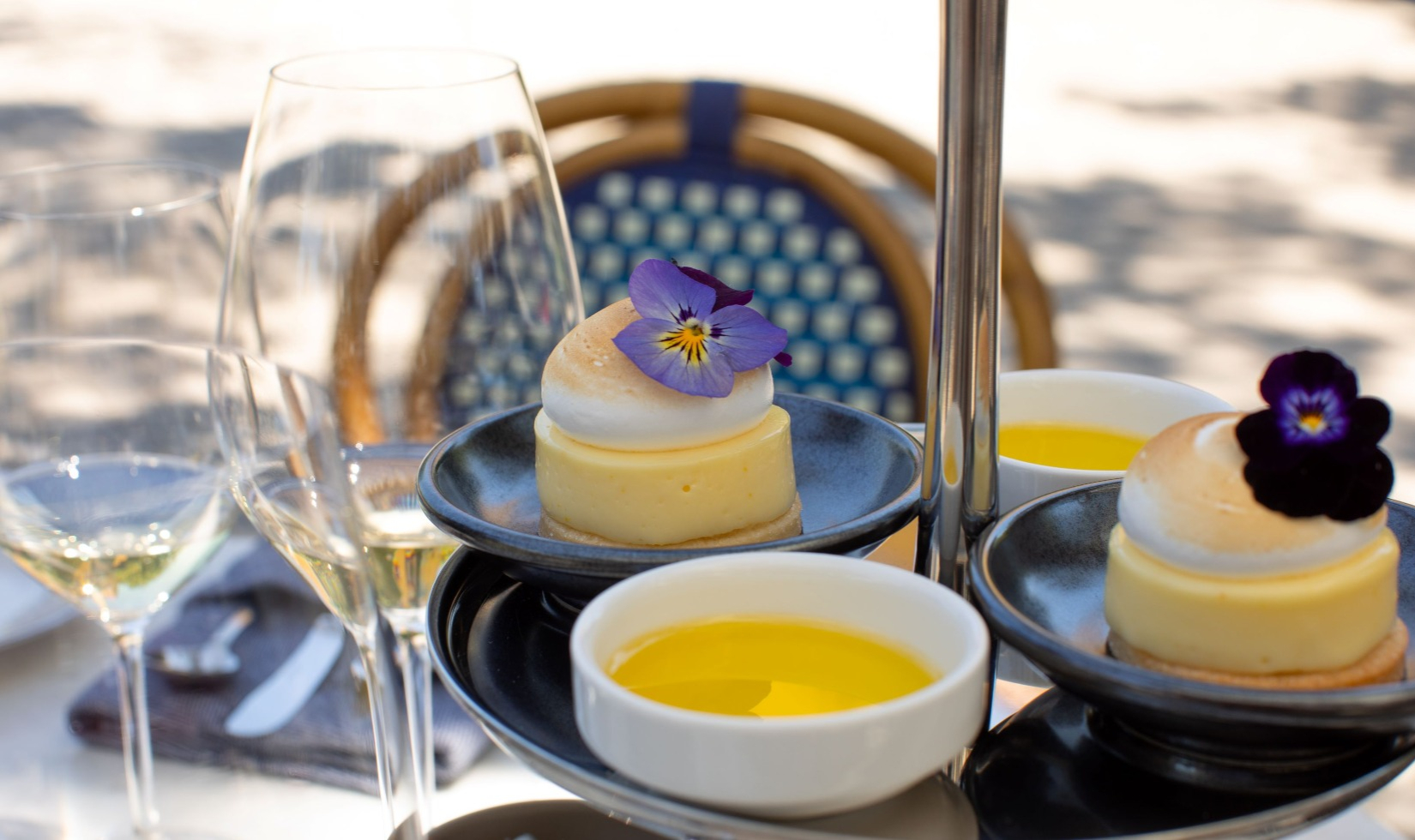 tiered tray of culinary bites for wine featured lemon tarts and olive oil