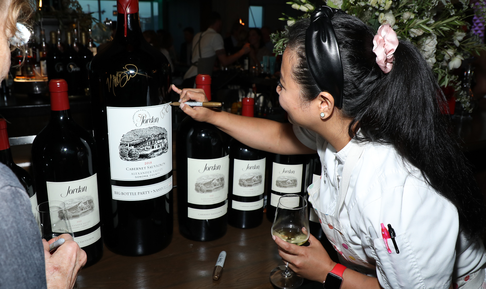 Chefs signing big bottles of Jordan Cabernet Sauvignon at Jordan's Big Bottle Party in Nashville.
